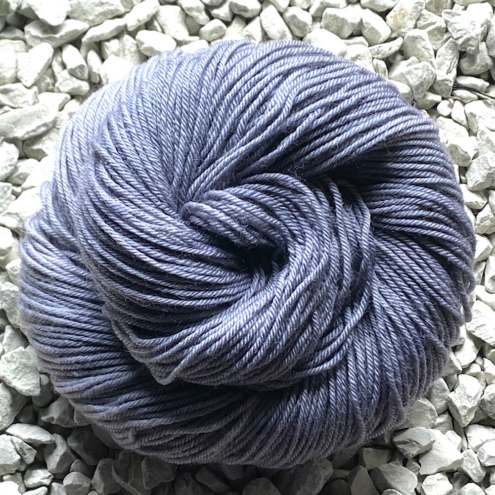 BFL DK in 'Seal Grey' a semi solid dye style in flowing mid greys and a cream-toned grey