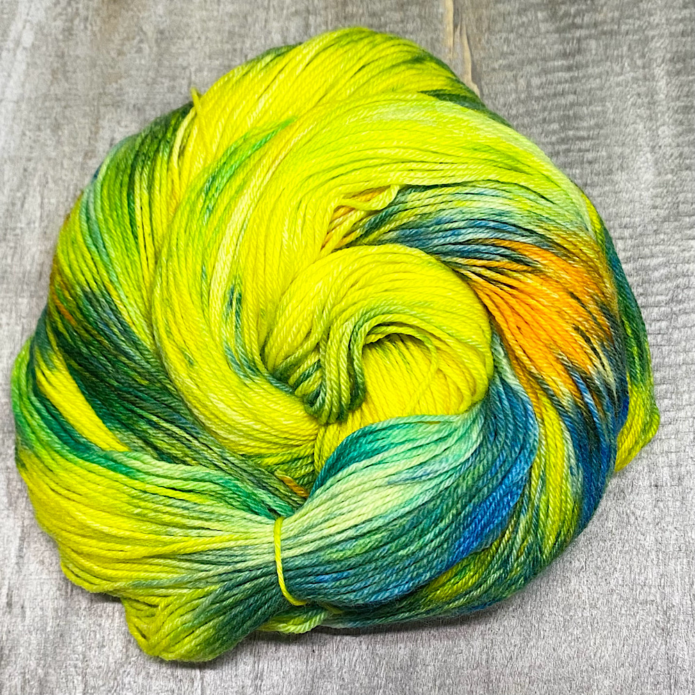 A swirl of hand dyed MCN yarn in colour 'Landscape'