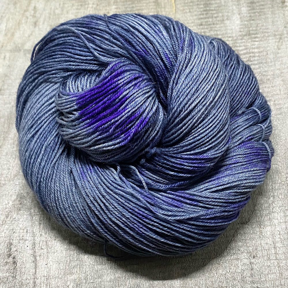 Hand dyed yarns in grey and deep purple